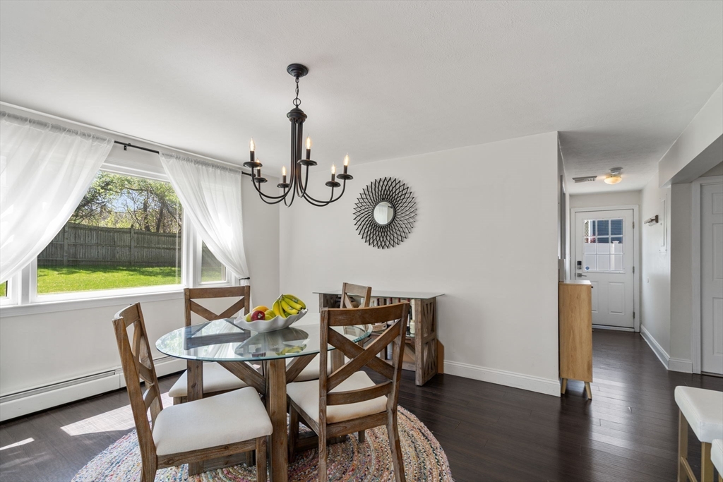 5 Eclipse Avenue Chelmsford, MA 01824 - Photo 9 of 25 a view of a dining room with furniture window and wooden floor