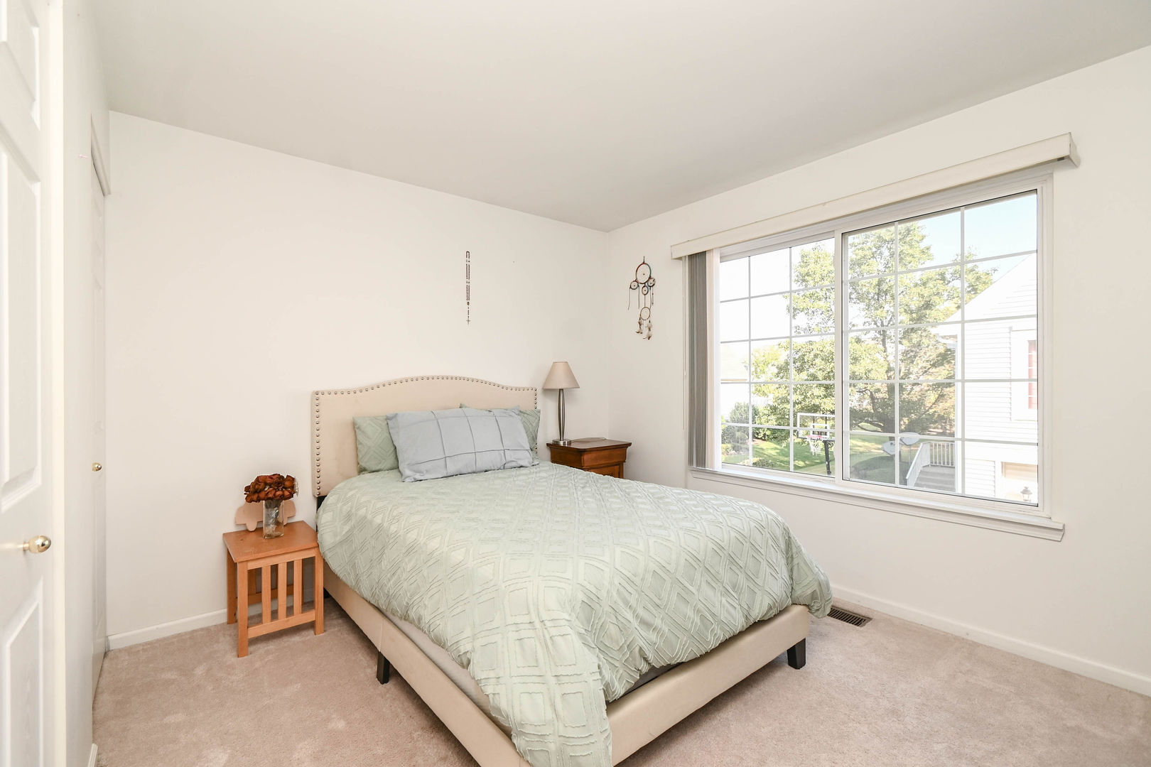 714 South Rosehall Lane Round Lake, IL 60073 - Photo 15 of 35 a bedroom with a bed and a large window