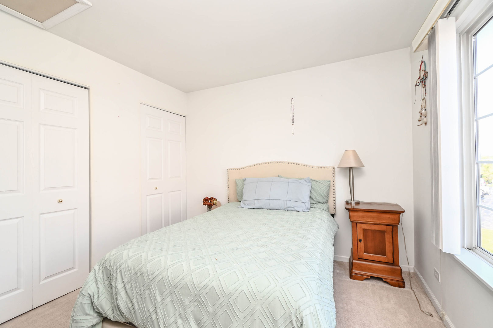 714 South Rosehall Lane Round Lake, IL 60073 - Photo 16 of 35 a bedroom with a bed and a window