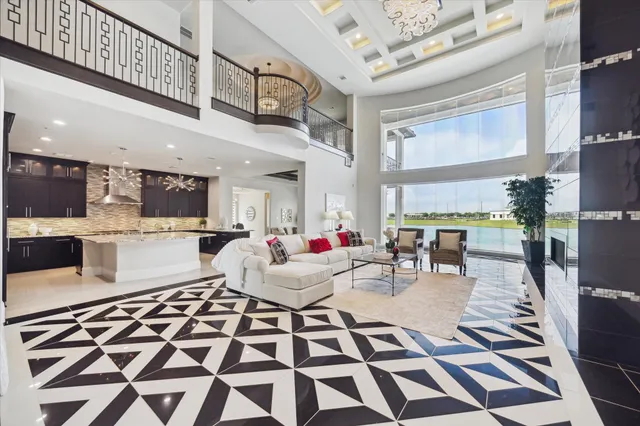 a living room with lots of furniture and a rug