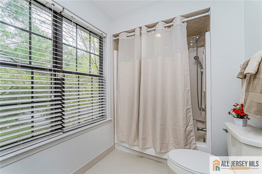 612 Chester Court Helmetta, NJ 08828 - Photo 19 of 31 a bathroom with a sink and a mirror