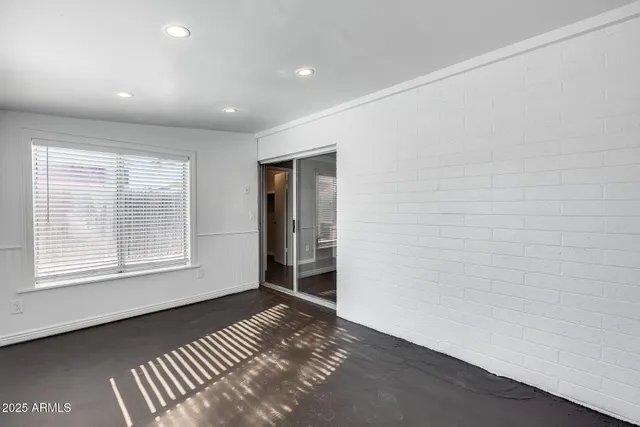a front view of a house with a yard and a garage