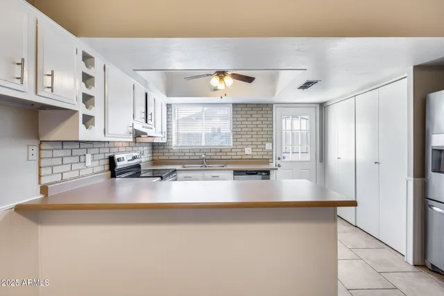 wooden floor in an empty room with a fireplace