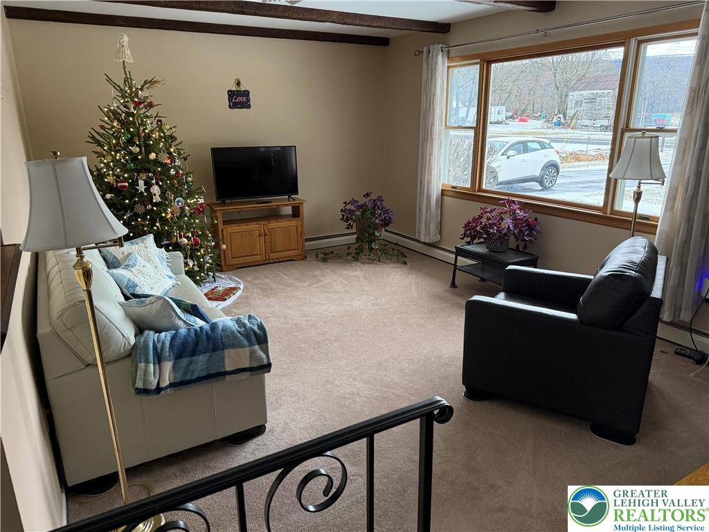 1445 Church Road Wind Gap, PA 18091 - Photo 12 of 37 a living room with furniture and a flat screen tv