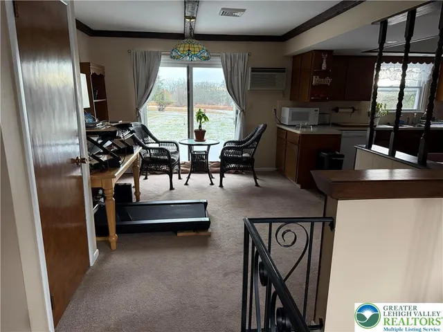 a kitchen with a refrigerator and a stove