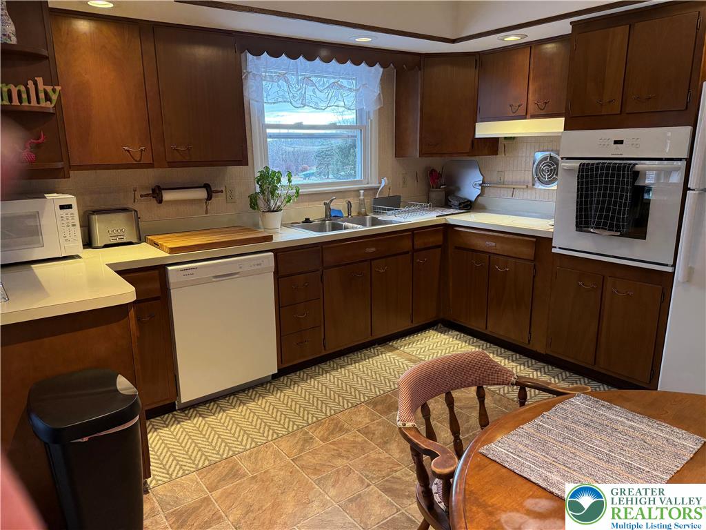 1445 Church Road Wind Gap, PA 18091 - Photo 19 of 37 a kitchen with a sink cabinets and window