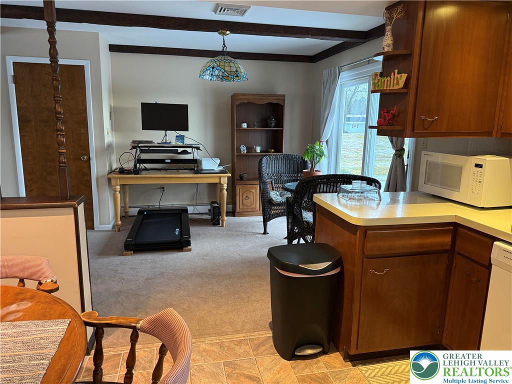 1445 Church Road Wind Gap, PA 18091 - Photo 21 of 37 a living room with furniture a flat screen tv and kitchen view