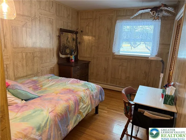 a bedroom with a bed and a mirror