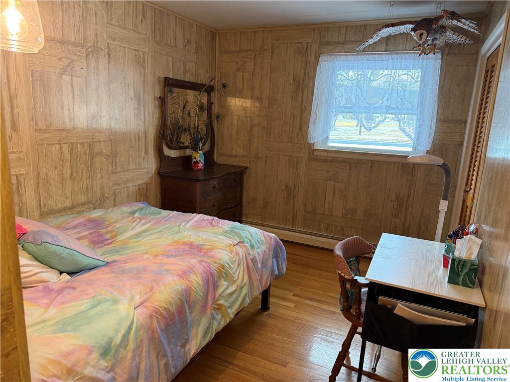 1445 Church Road Wind Gap, PA 18091 - Photo 22 of 37 a bedroom with a bed and a mirror
