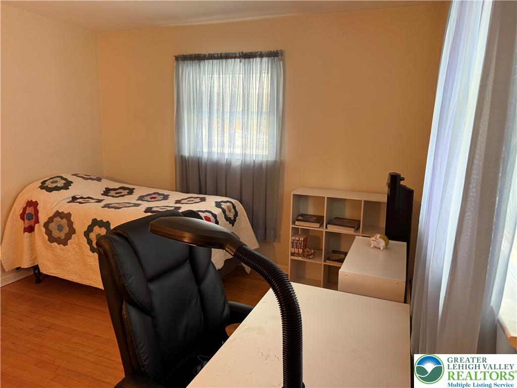 1445 Church Road Wind Gap, PA 18091 - Photo 25 of 37 a bed sitting in a bedroom next to a window