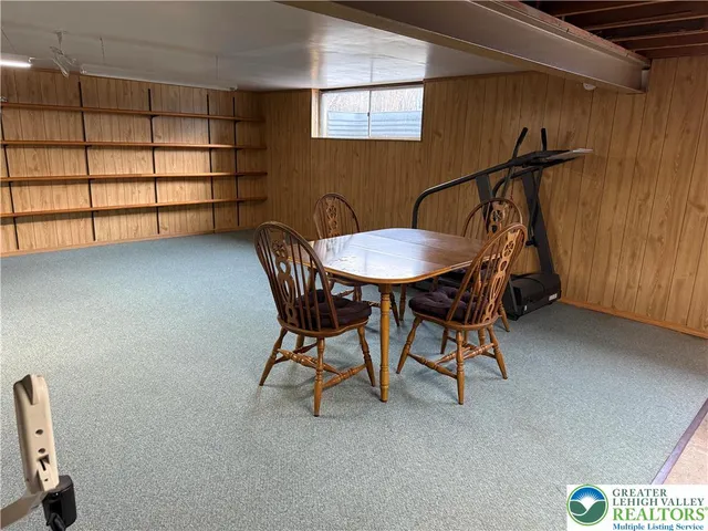 a view of a room with furniture and window