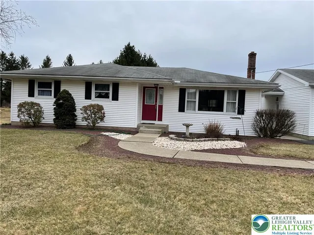 a front view of a house with patio