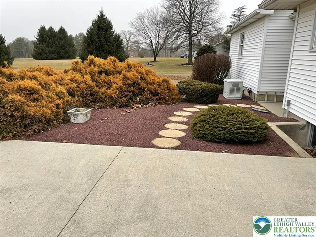 a view of a backyard of the house