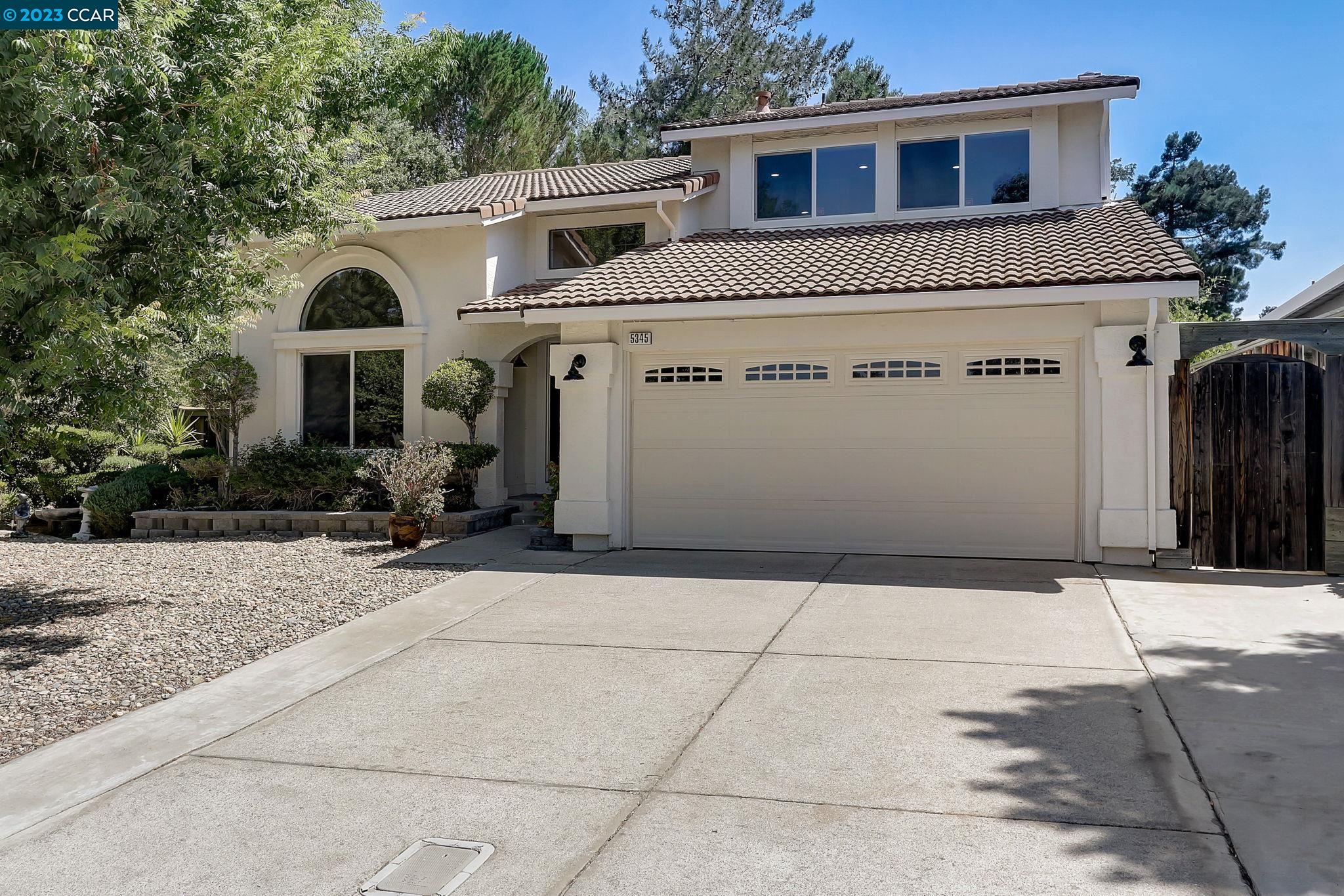 a front view of a house with yard