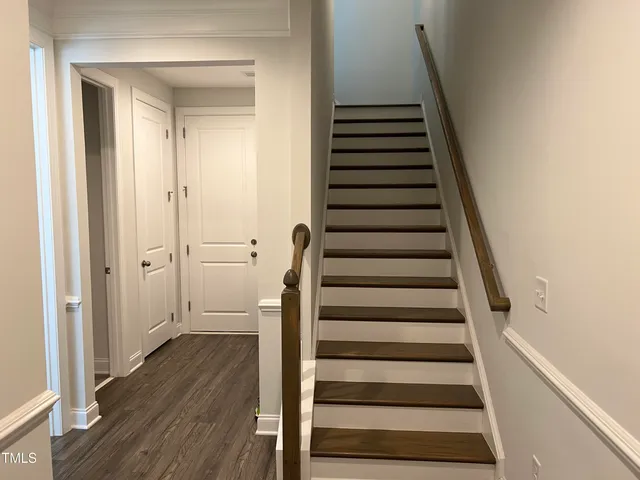 a view of an entryway with wooden floor