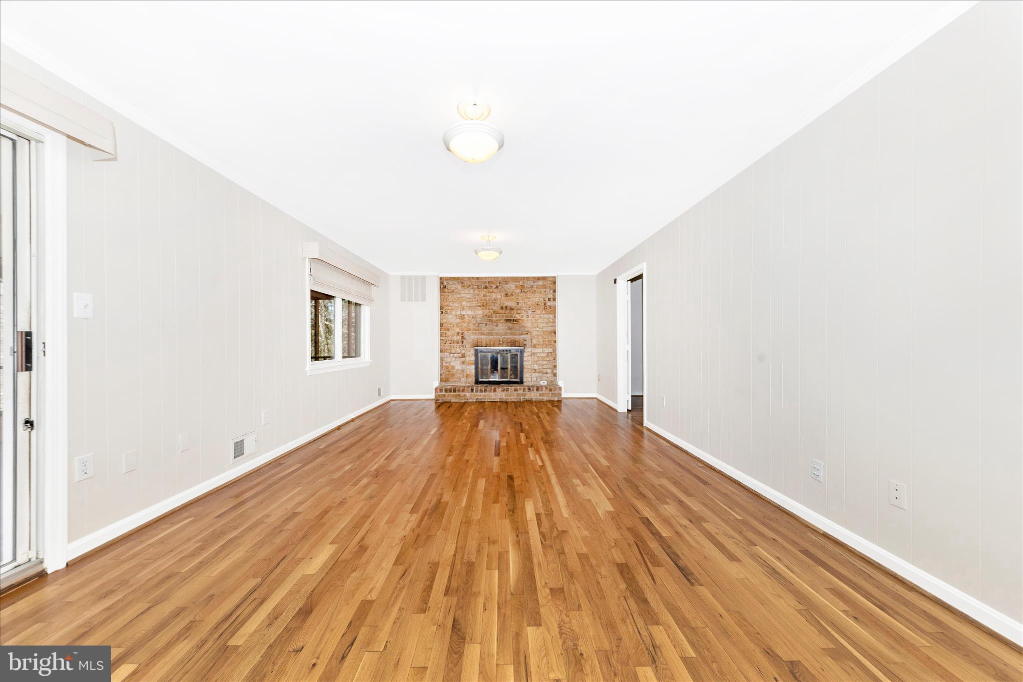 11806 Prestwick Road Potomac, MD 20854 - Photo 13 of 64 a view of empty room with wooden floor