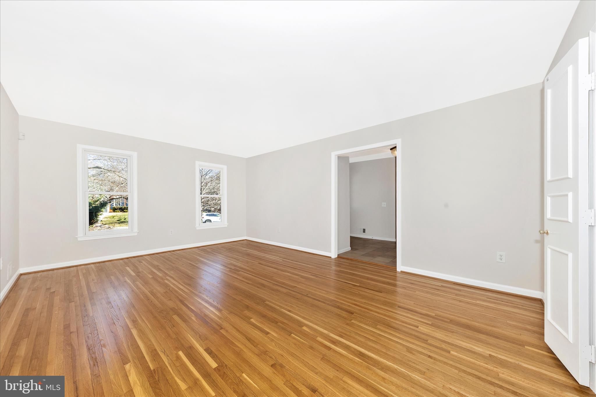 11806 Prestwick Road Potomac, MD 20854 - Photo 15 of 64 an empty room with window and wooden floor