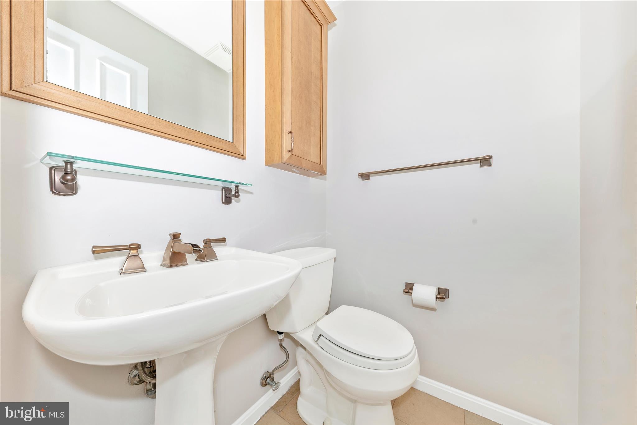 11806 Prestwick Road Potomac, MD 20854 - Photo 19 of 64 a bathroom with a sink and a toilet