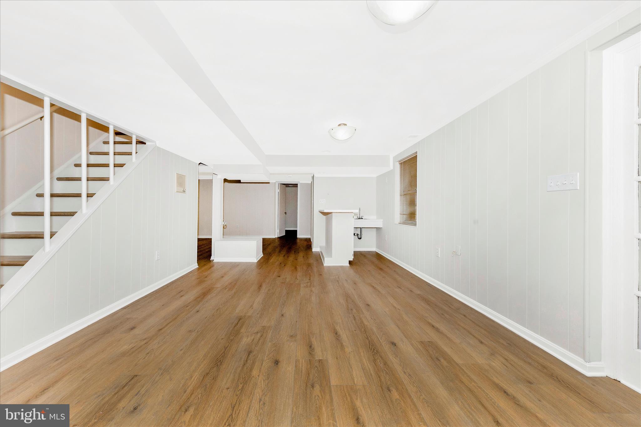 11806 Prestwick Road Potomac, MD 20854 - Photo 41 of 64 a view of empty room with wooden floor and window