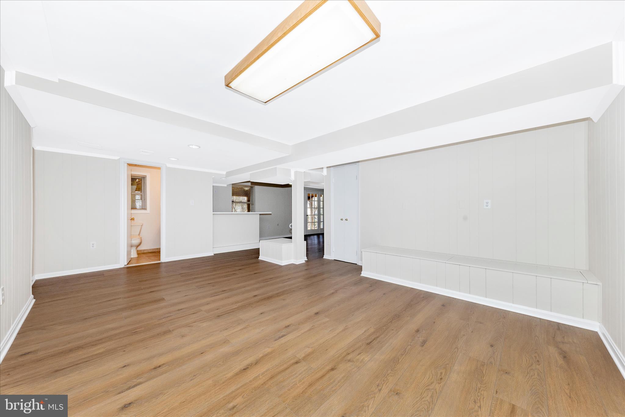 11806 Prestwick Road Potomac, MD 20854 - Photo 46 of 64 a view of empty room with wooden floor