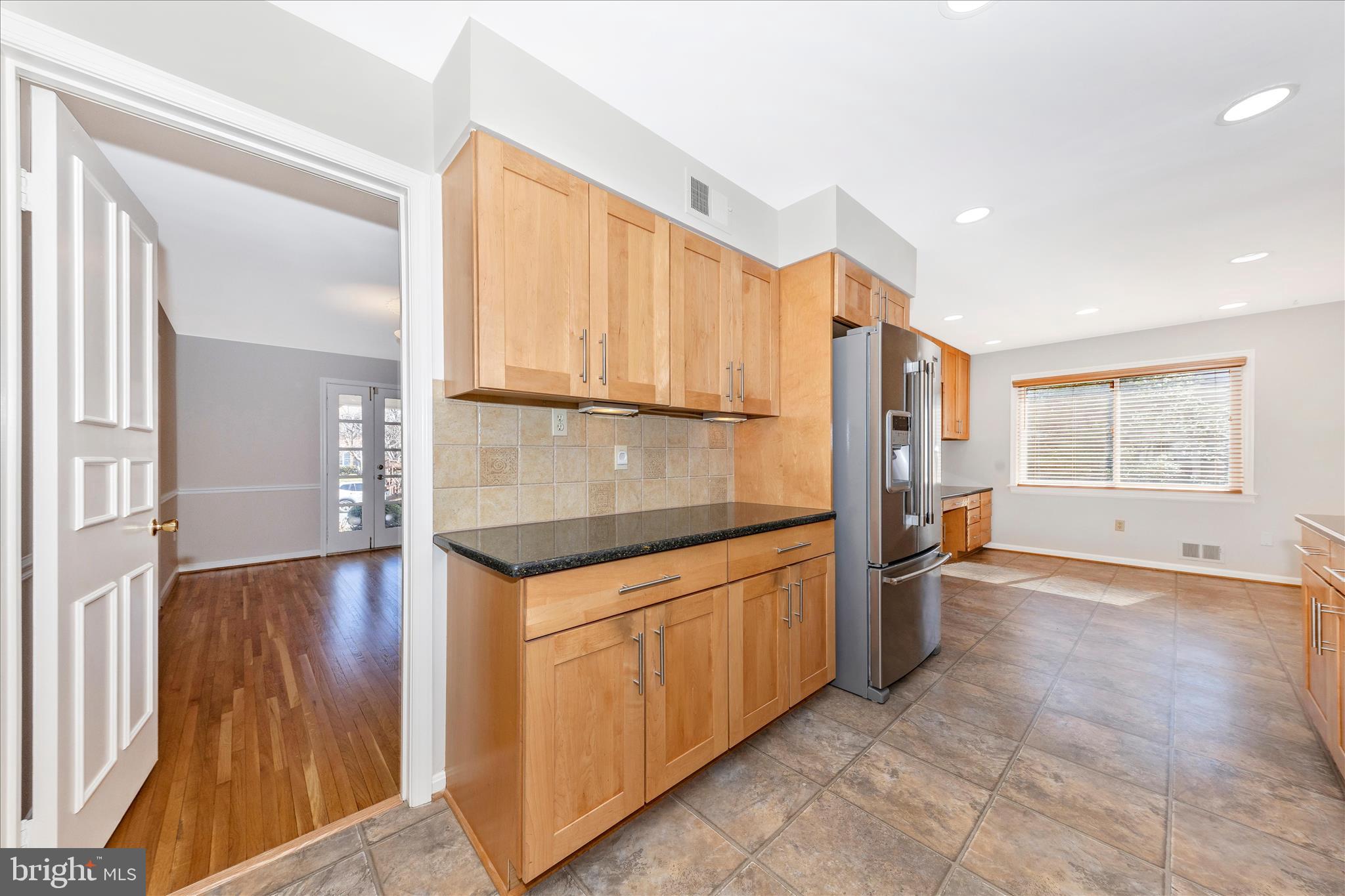 11806 Prestwick Road Potomac, MD 20854 - Photo 10 of 64 a kitchen with stainless steel appliances granite countertop a refrigerator and a stove top oven