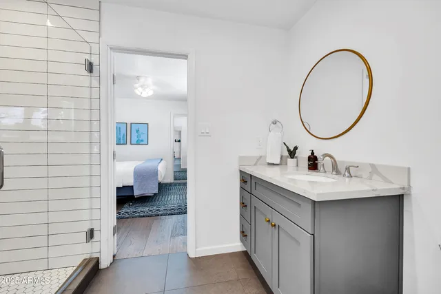 a bathroom with a sink and mirror