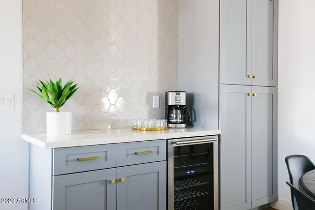 a backyard of a house with table and chairs