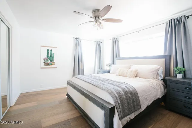 a bedroom with a bed and a window