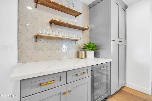 a large kitchen with stainless steel appliances lots of counter space and a sink