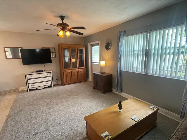 a room with furniture and flat screen tv
