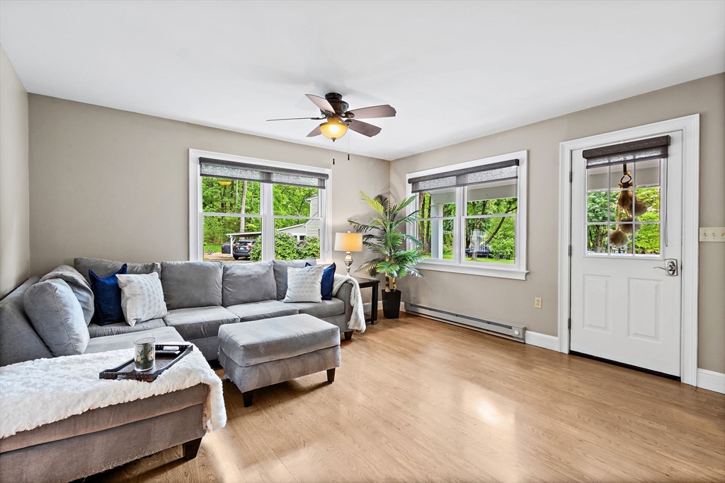 61 Pine Ridge Drive Franklin, MA 02038 - Photo 7 of 41 a living room with furniture and a window