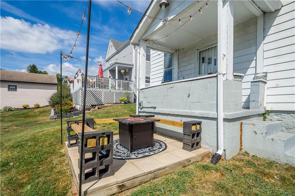 34 Altamont Street Washington, PA 15301 - Photo 29 of 38 Picture depicts rear covered porch, bench seating, and firepit.
