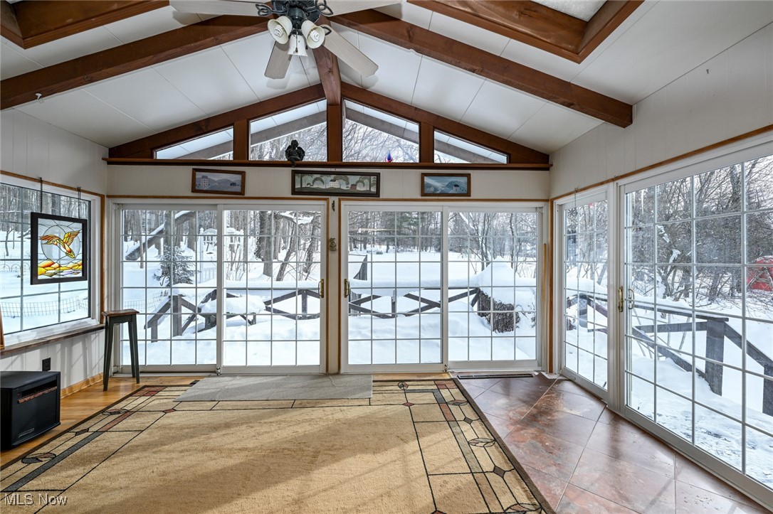 30875 Cannon Road Solon, OH 44139 - Photo 19 of 48 Sunroom with beamed ceiling, healthy amount of natural light, and high vaulted ceiling