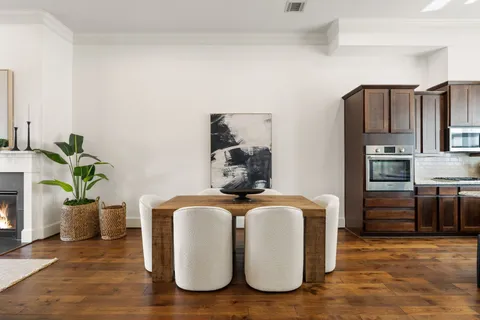 a bedroom with furniture and a kitchen