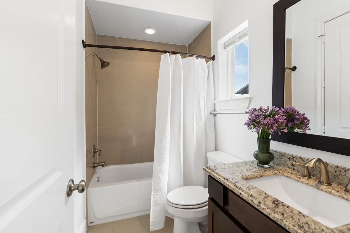 2960 Rusk Street Houston, TX 77003 - Photo 22 of 29 a bathroom with a granite countertop sink toilet and shower