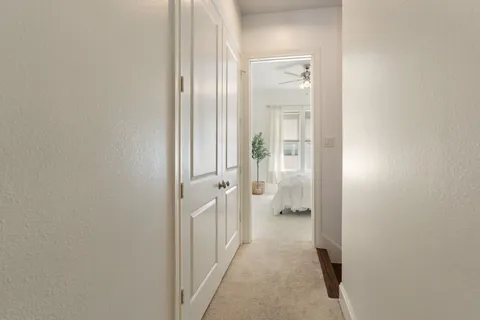a view of a bathroom from a hallway