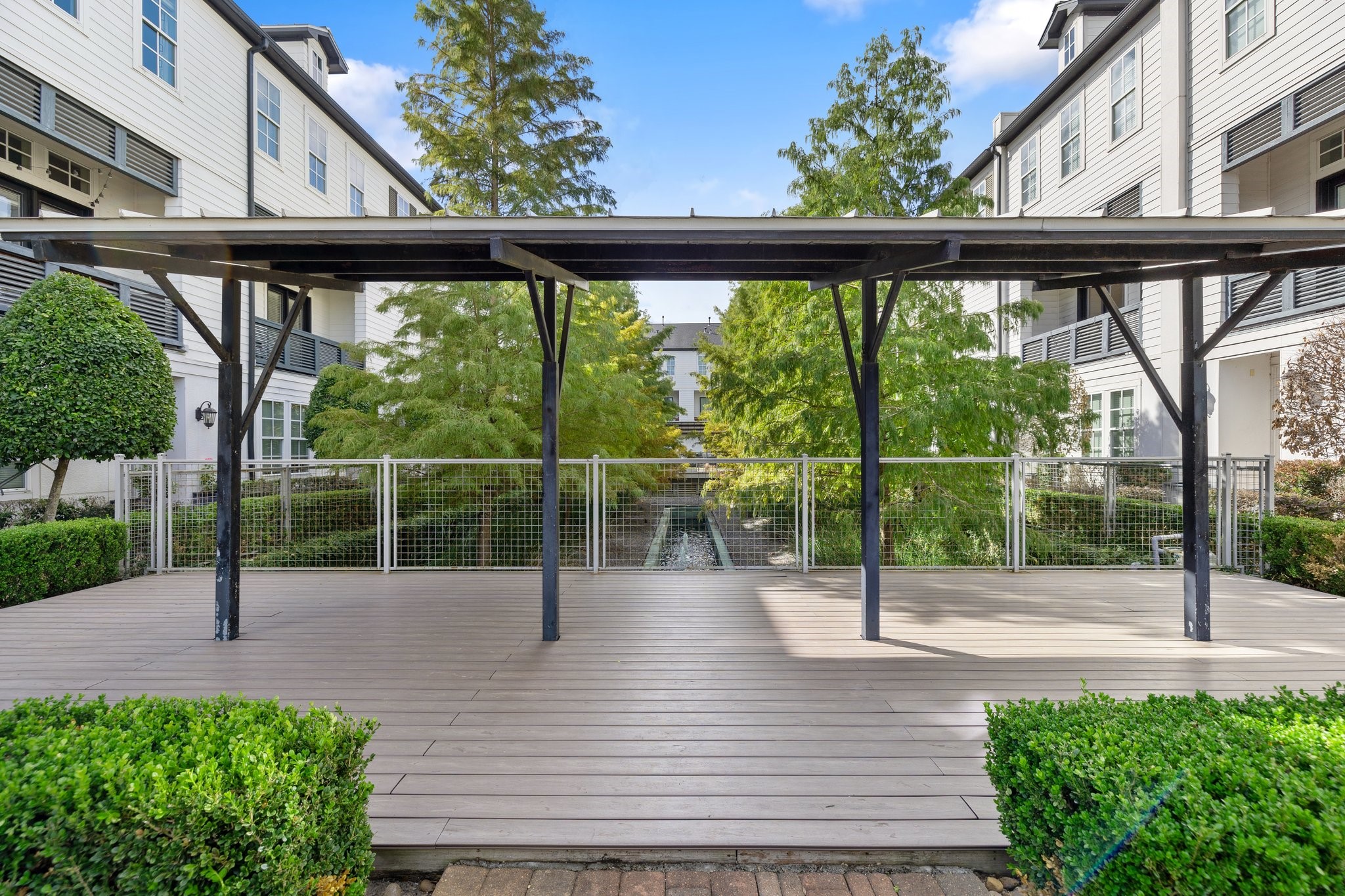 2960 Rusk Street Houston, TX 77003 - Photo 27 of 29 Communal areas include this covered patio overlooking a peaceful water feature.