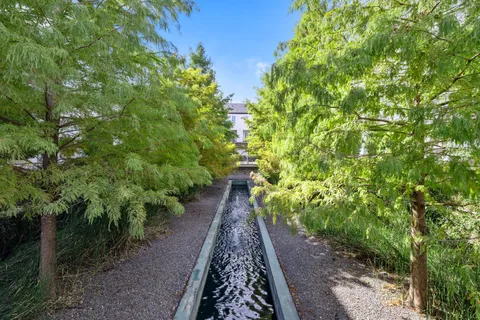 a view of a pathway both side of yard
