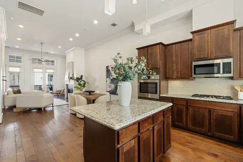 a kitchen with sink cabinets and microwave