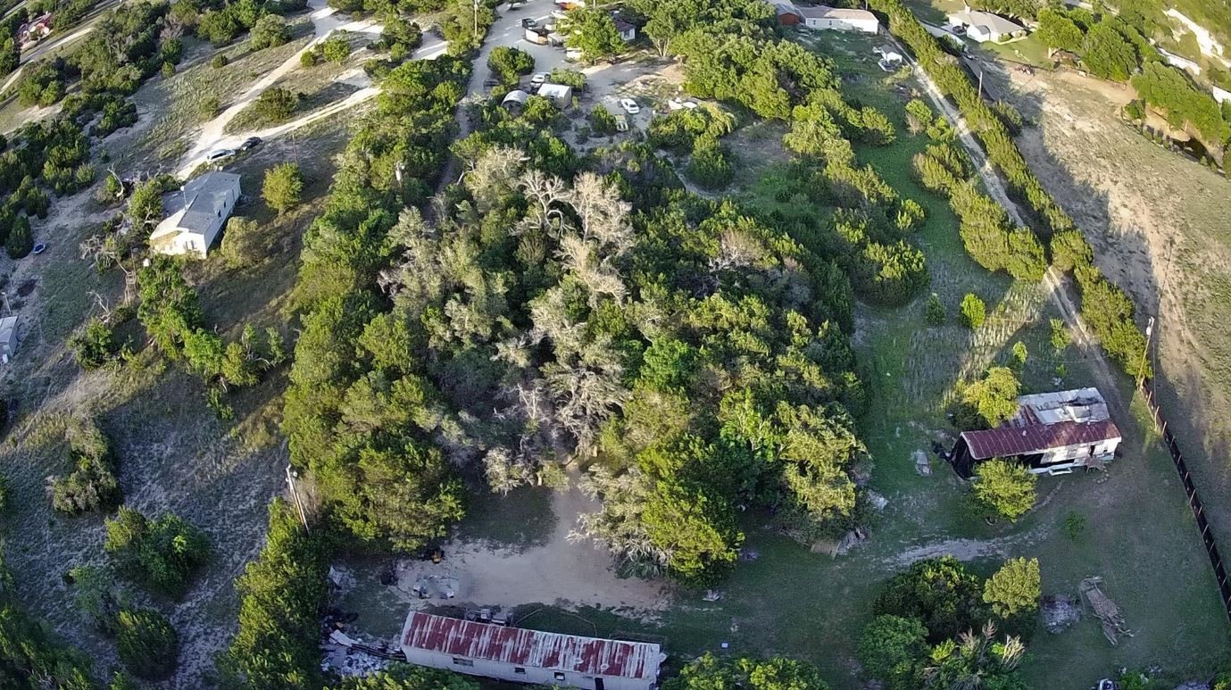 1275 County Road 4820 Kempner, TX 76539 - Photo 2 of 5 an aerial view of a house with a yard and lake view