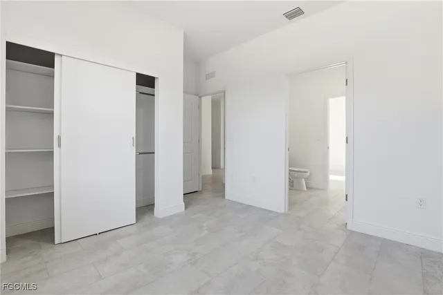 an empty room with a bathroom