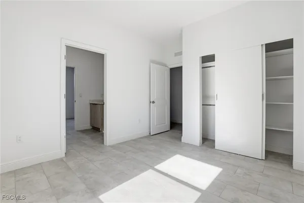 a bathroom with a toilet sink and a mirror