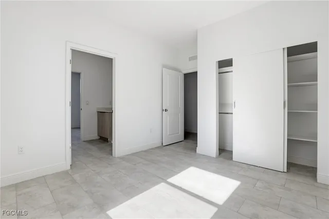 a bathroom with a toilet sink and a mirror