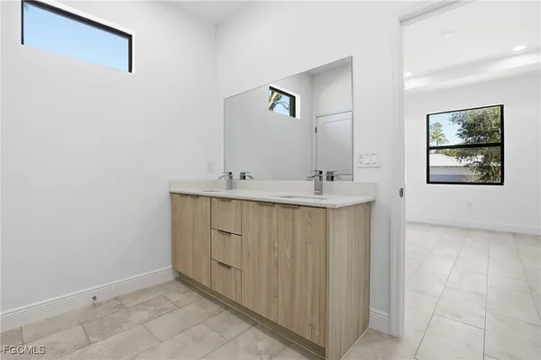 a bathroom with a sink and a mirror