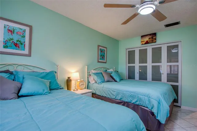 a bedroom with double bed and a window