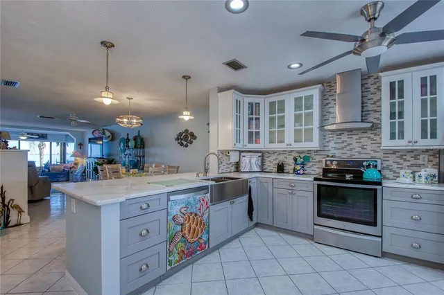 a large kitchen with a table and chairs