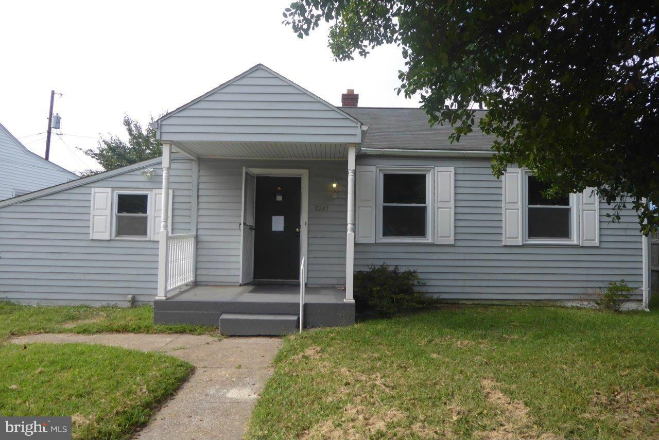 8247 Bullneck Road Baltimore, MD 21222 - Photo 1 of 16 a front view of a house with a garden