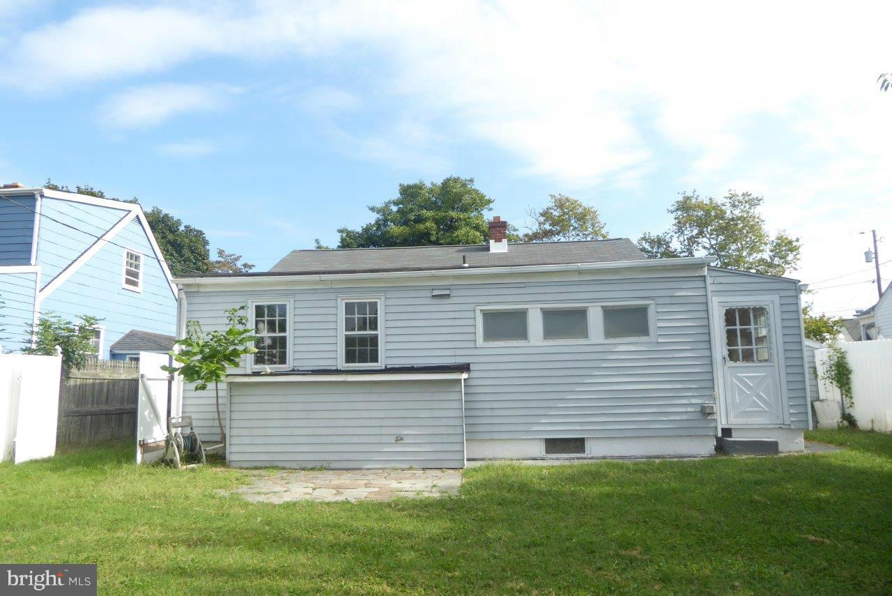8247 Bullneck Road Baltimore, MD 21222 - Photo 2 of 16 a view of a house with a yard and a garden