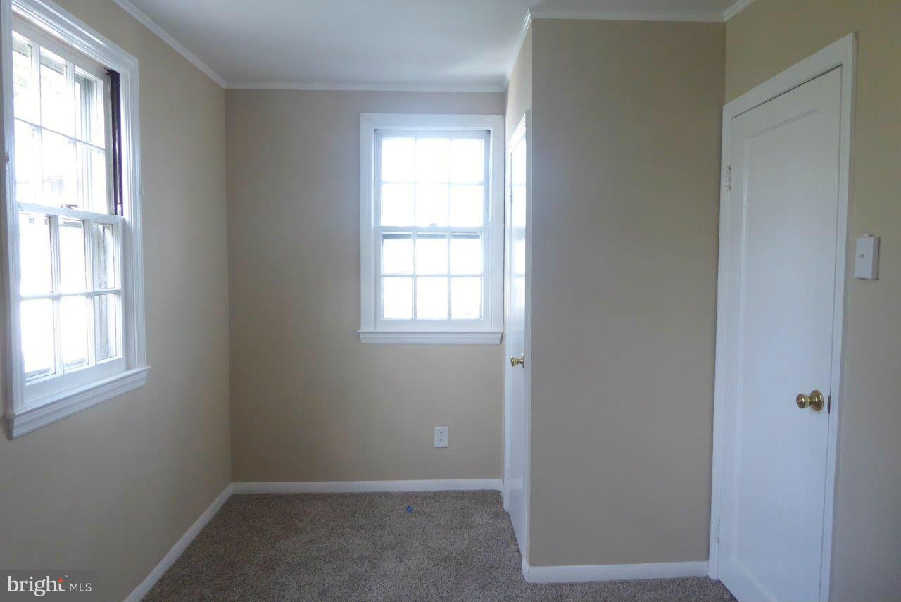 8247 Bullneck Road Baltimore, MD 21222 - Photo 12 of 16 an empty room with windows