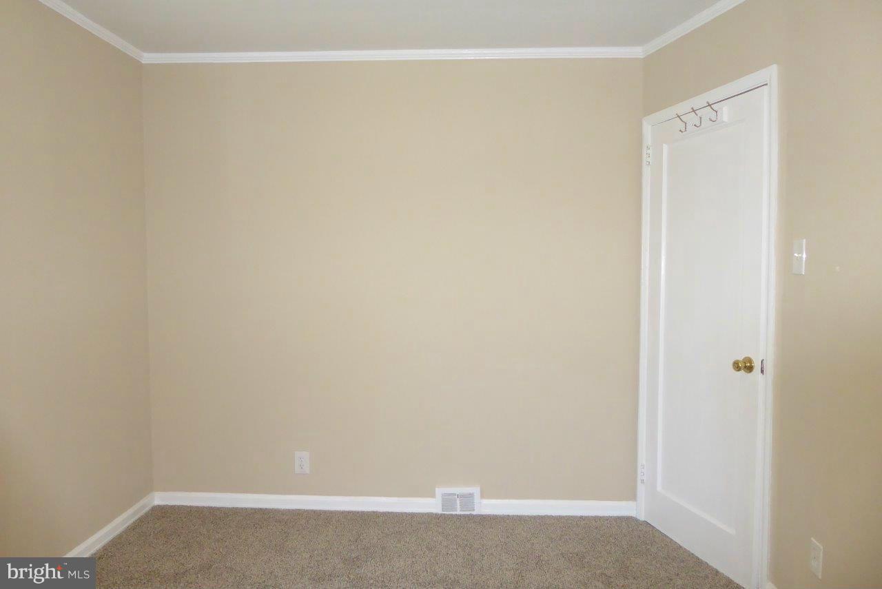 8247 Bullneck Road Baltimore, MD 21222 - Photo 8 of 16 a room that has a window in it